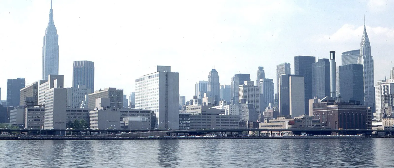 The Manhattan skyline seen across the water, with the Empire State Building
